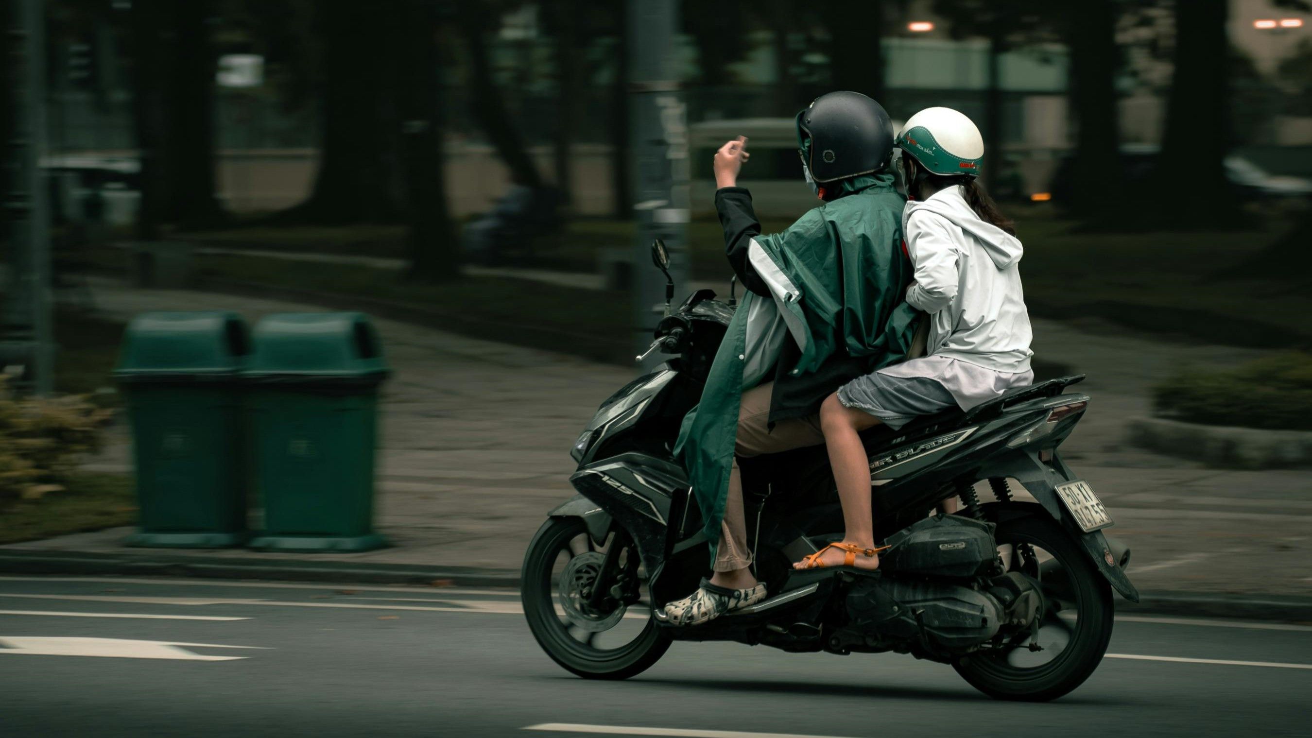 Riding scooter in Hanoi