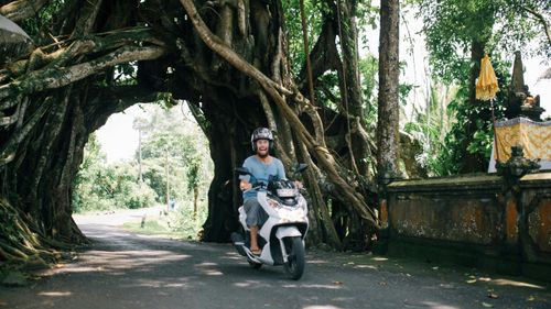 Riding scooter in Hanoi